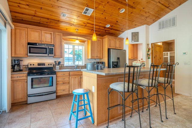 24294 Dersch Rd, Anderson, CA 96007 - kitchen with stainless steel appliances, wooden ceiling, a breakfast bar, pendant lighting, and a sink