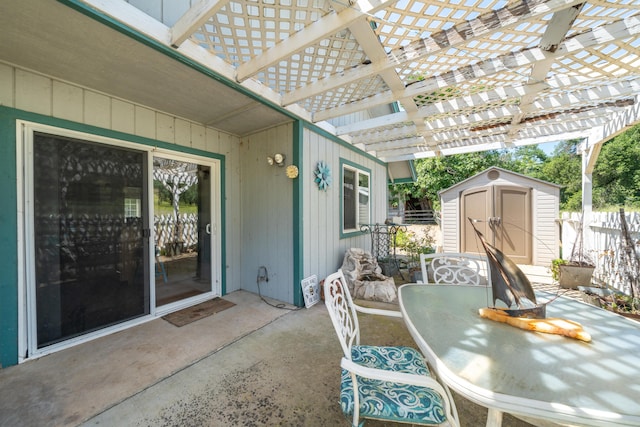 24294 Dersch Rd, Anderson, CA 96007 - view of patio / terrace with a shed, outdoor dining area, fence, an outbuilding, and a pergola