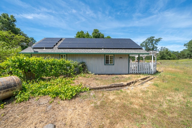 24294 Dersch Rd, Anderson, CA 96007 - view of property exterior featuring roof mounted solar panels and a shingled roof