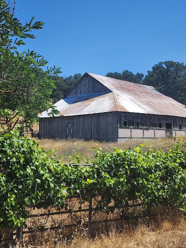 24294 Dersch Rd, Anderson, CA 96007 - view of side of home featuring an outdoor structure and an outbuilding