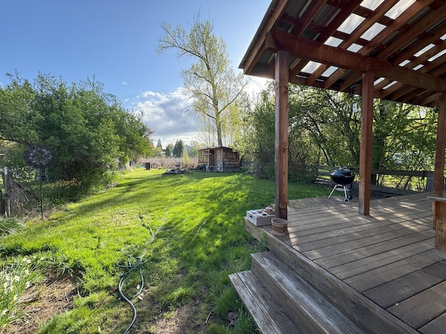 view of yard featuring an outbuilding and a wooden deck