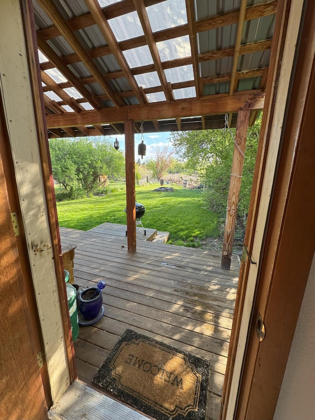 wooden deck featuring a yard