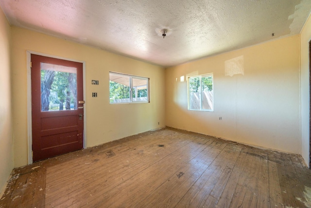 1390 Branstetter Ln, Redding, CA 96001 - entrance foyer with a textured ceiling and hardwood / wood-style flooring