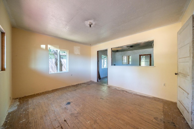 1390 Branstetter Ln, Redding, CA 96001 - spare room featuring hardwood / wood-style flooring and a textured ceiling