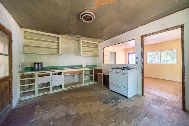 1390 Branstetter Ln, Redding, CA 96001 - kitchen with open shelves, dark wood-style flooring, wood ceiling, and white gas stove