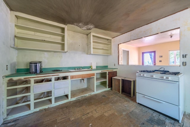 1390 Branstetter Ln, Redding, CA 96001 - kitchen featuring open shelves and white gas stove