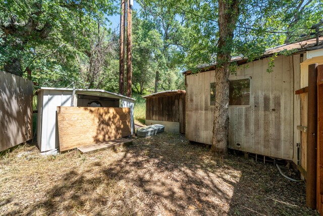 1390 Branstetter Ln, Redding, CA 96001 - view of yard with an outdoor structure and a shed