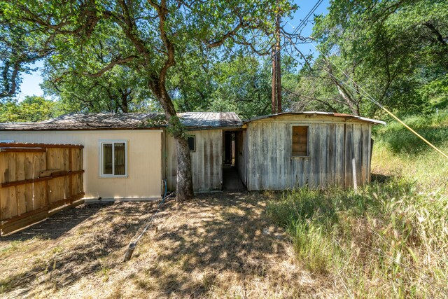 1390 Branstetter Ln, Redding, CA 96001 - rear view of house featuring fence
