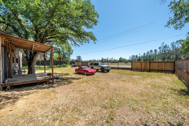 1390 Branstetter Ln, Redding, CA 96001 - view of yard with a fenced backyard and a wooden deck