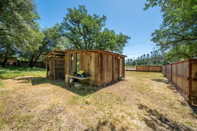 1390 Branstetter Ln, Redding, CA 96001 - view of outbuilding featuring a fenced backyard and an outbuilding