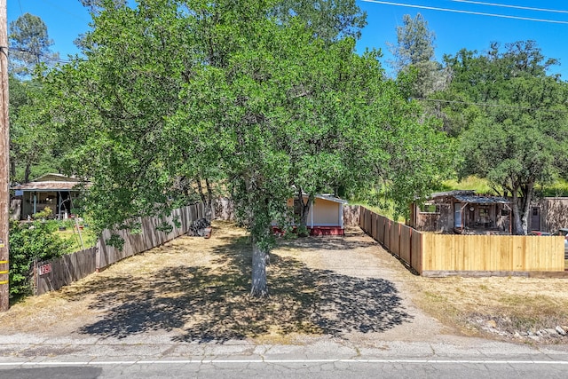 1390 Branstetter Ln, Redding, CA 96001 - view of front facade with a fenced front yard and driveway