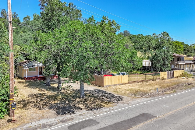 1390 Branstetter Ln, Redding, CA 96001 - view of front of house with fence and aphalt driveway