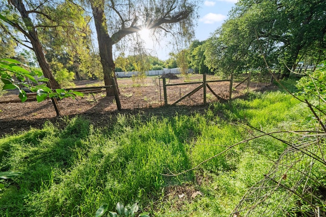 view of property's community featuring fence