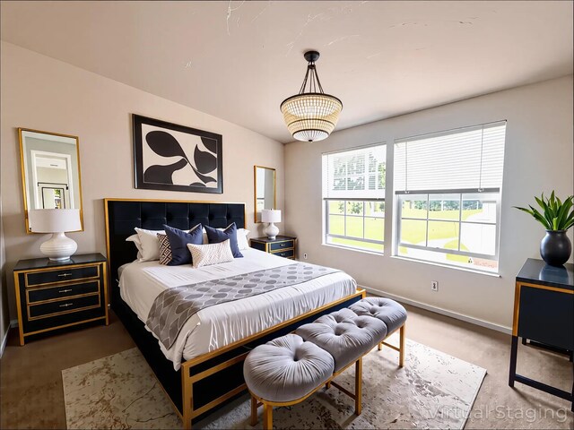 bedroom featuring lofted ceiling, light carpet, and baseboards