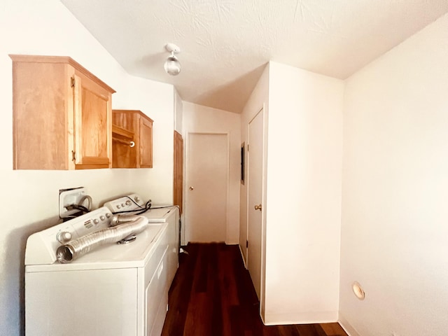 laundry room with dark wood-style floors, separate washer and dryer, and cabinet space
