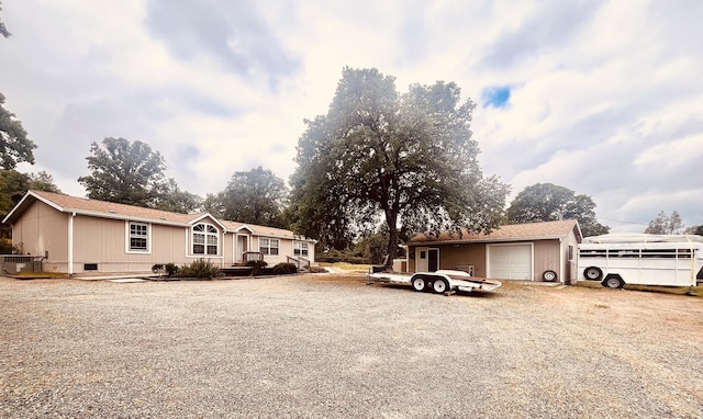view of front of home featuring driveway and a garage