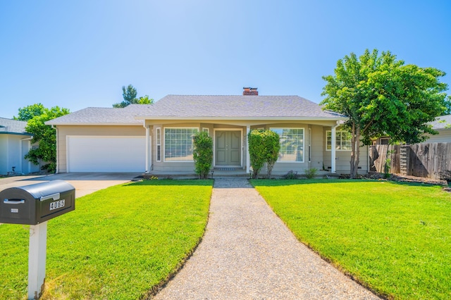 single story home with driveway, a chimney, a front yard, a garage, and fence
