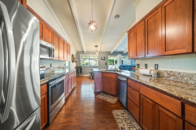 kitchen featuring beam ceiling, brown cabinetry, stainless steel appliances, a peninsula, and dark wood-style floors