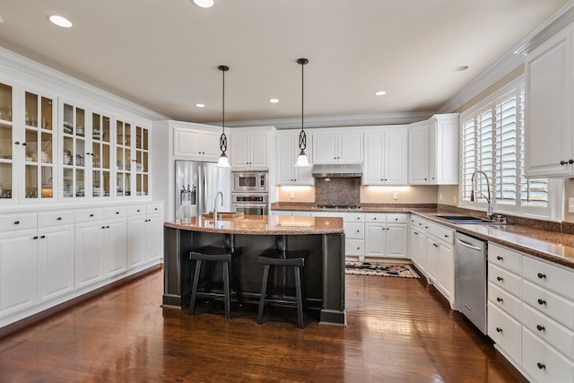 kitchen featuring a sink, appliances with stainless steel finishes, and dark wood-type flooring