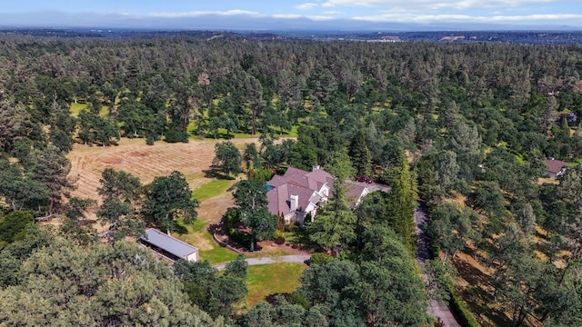 drone / aerial view with a view of trees