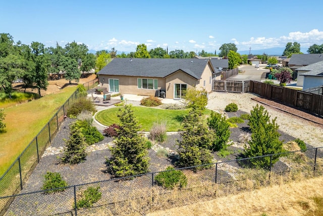 20295 Ballentine Dr, Anderson, CA 96007 - rear view of house with a fenced backyard, a patio, and stucco siding