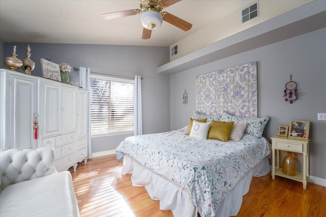 bedroom featuring baseboards, visible vents, and light wood-style flooring