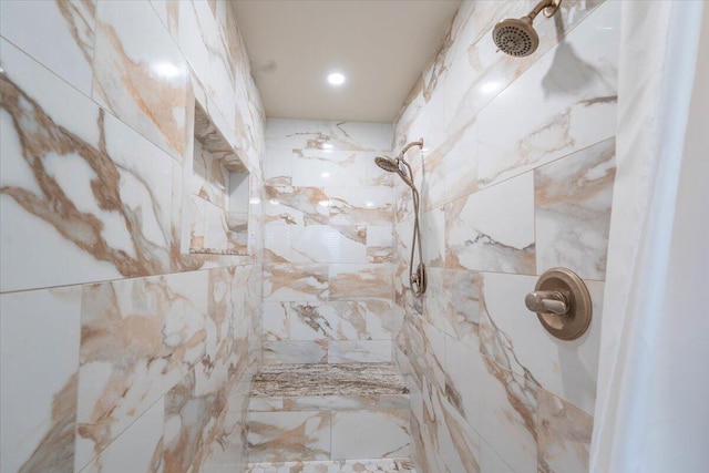bathroom with tiled shower