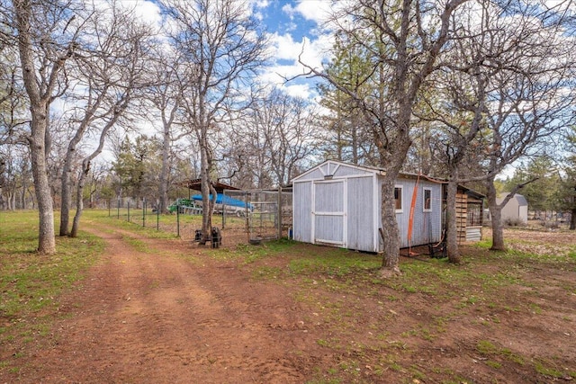 view of yard with an outdoor structure and a storage unit