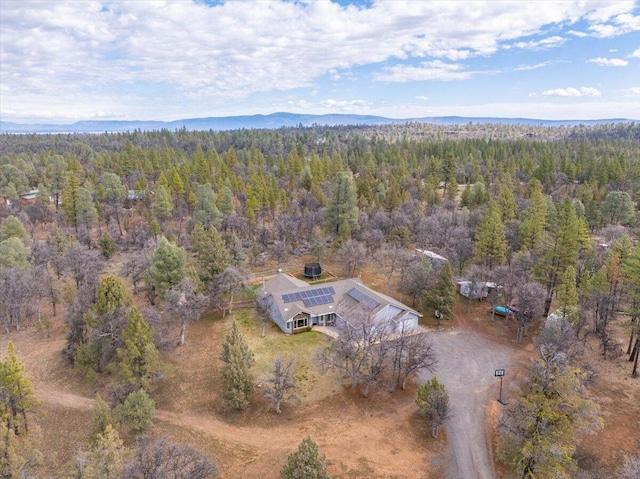 aerial view featuring a view of trees