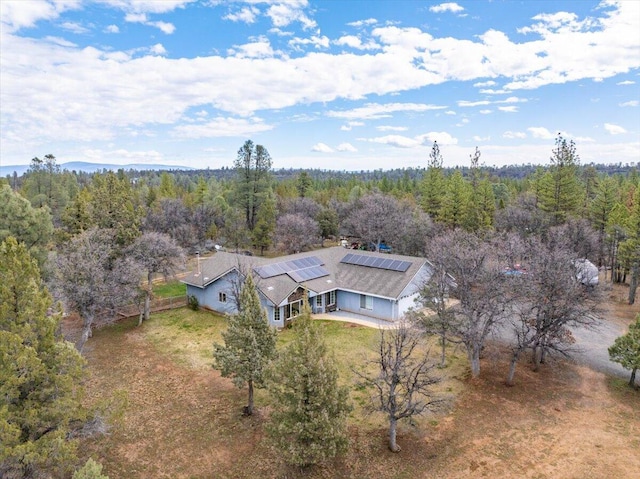 bird's eye view featuring a forest view