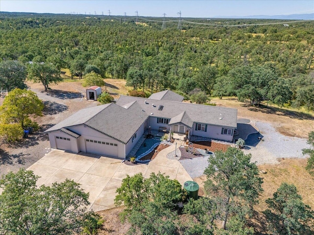 drone / aerial view with a view of trees