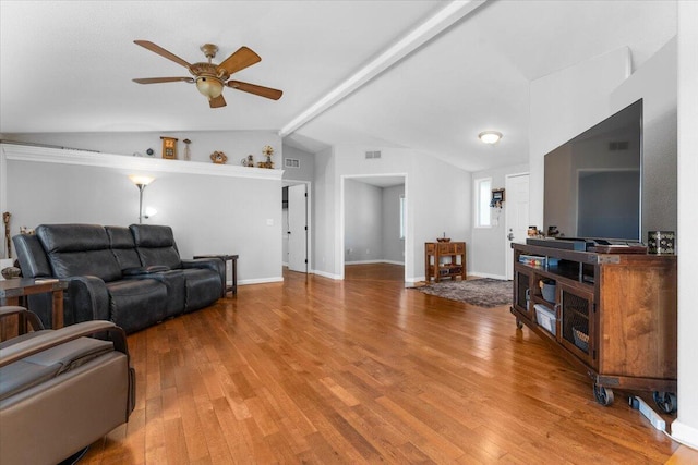 living room featuring visible vents, wood finished floors, baseboards, ceiling fan, and vaulted ceiling