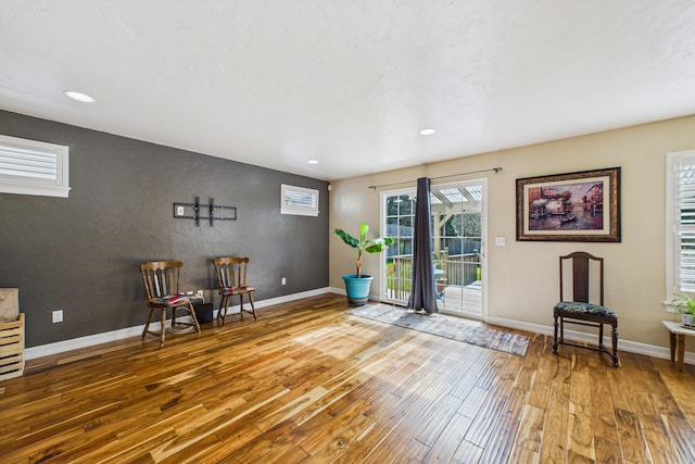sitting room with recessed lighting, wood finished floors, and baseboards