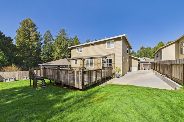 back of house with a deck, a fenced backyard, and a patio area