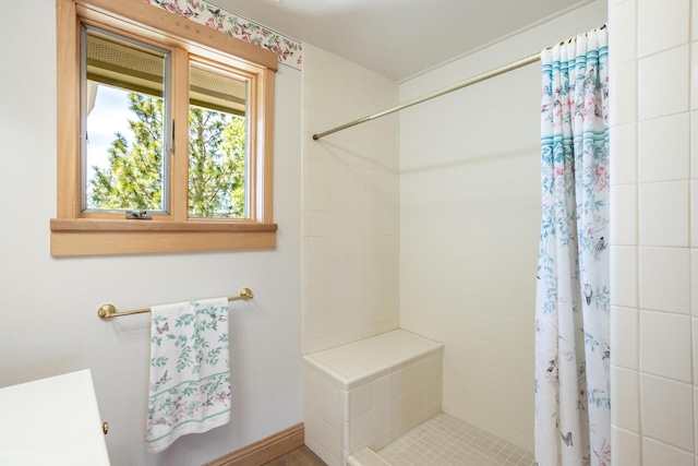 bathroom featuring a tile shower