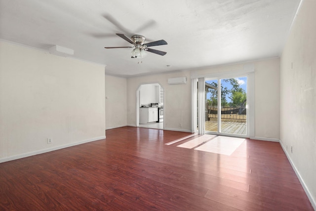 3169 Veda St, Redding, CA 96001 - empty room with a wall mounted air conditioner, ceiling fan, wood finished floors, arched walkways, and ornamental molding