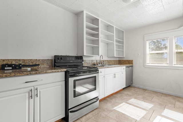 3169 Veda St, Redding, CA 96001 - kitchen with stainless steel appliances, open shelves, a sink, white cabinetry, and light tile patterned floors