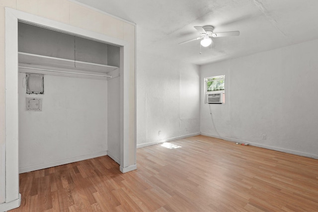 3169 Veda St, Redding, CA 96001 - unfurnished bedroom with wood finished floors, baseboards, cooling unit, and a ceiling fan