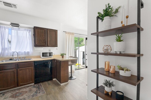 3150-3180 Franklin St, Anderson, CA 96007 - kitchen with a sink, light wood finished floors, dishwasher, white microwave, and visible vents