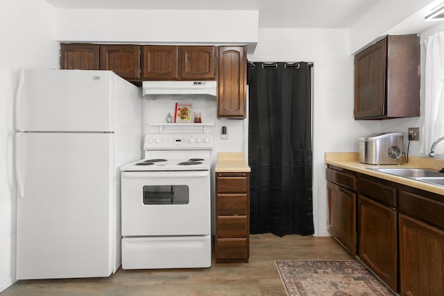 3150-3180 Franklin St, Anderson, CA 96007 - kitchen with a sink, light countertops, light wood-style floors, under cabinet range hood, and white appliances