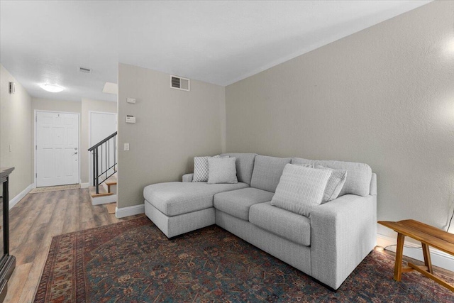 1968 Bechelli Ln, Redding, CA 96002 - living room with wood finished floors, baseboards, and stairway