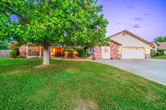 3301 Bridger Dr, Redding, CA 96002 - view of front facade featuring an attached garage, brick siding, and concrete driveway