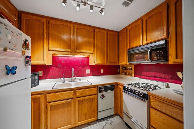 3301 Bridger Dr, Redding, CA 96002 - kitchen with white appliances, a sink, light marble finish floors, light countertops, and brown cabinetry