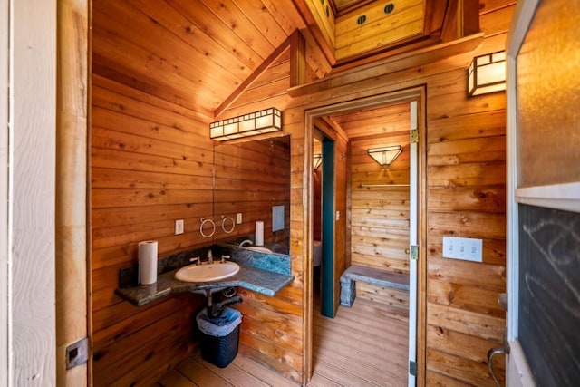 3301 Bridger Dr, Redding, CA 96002 - bathroom with wood walls, a sink, vaulted ceiling, wood ceiling, and wood finished floors