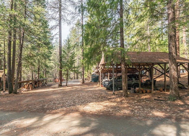 view of yard with a view of trees