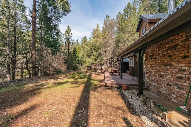 view of yard with a deck