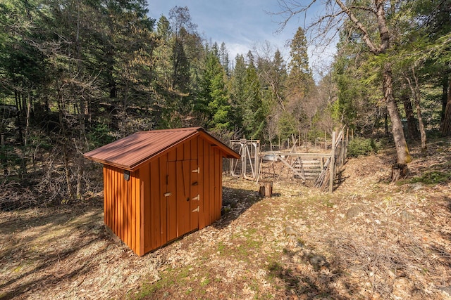 view of shed featuring a forest view