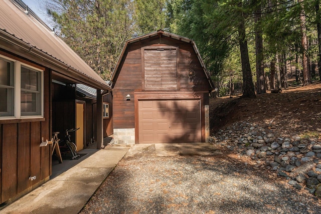 garage featuring driveway and a garage