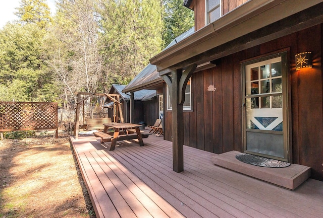wooden deck with outdoor dining area