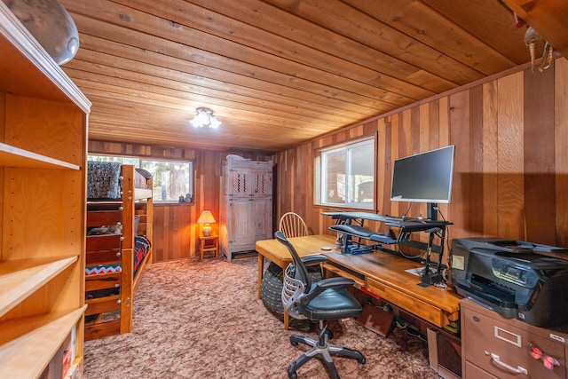 office area featuring carpet flooring, wood ceiling, and wooden walls